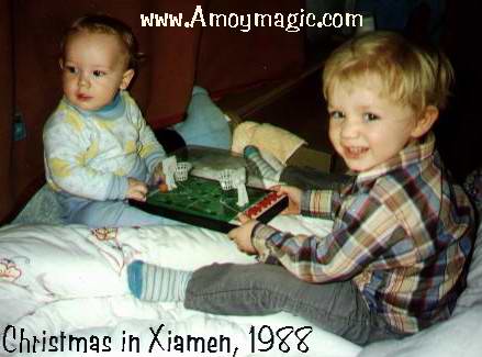 Christmas in Xiamen, 1988.  Shannon was 2 and Matthew was 9 months.  There was nothing festive about Christmas the first few years, but over the years the popularity of Christmas has grown in Xiamen, and in 2003, at least one Christmas party that we know of had over 2000 people!  Amoy Magic--Guide to Xiamen and Fujian (tourism, travel, study, expatriate lifestyle)  //www.amoymagic.com